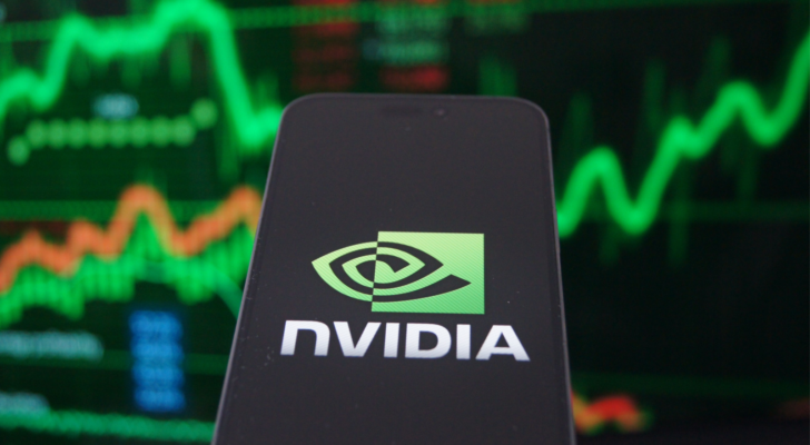 Nvidia corporation (NVDA) logo displayed on smartphone with stock market chart background. Nvidia is a global leader in artificial intelligence hardware.