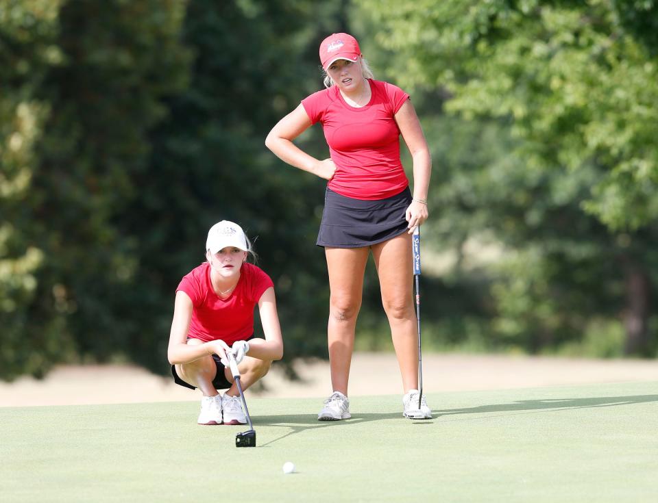 Brooklyn Benn (red hat) from OCS and Alex Peters from OCS during the All-State golf tournament at Cherokee Hils Golf Club in Catoosa, OK, July 25, 2022.