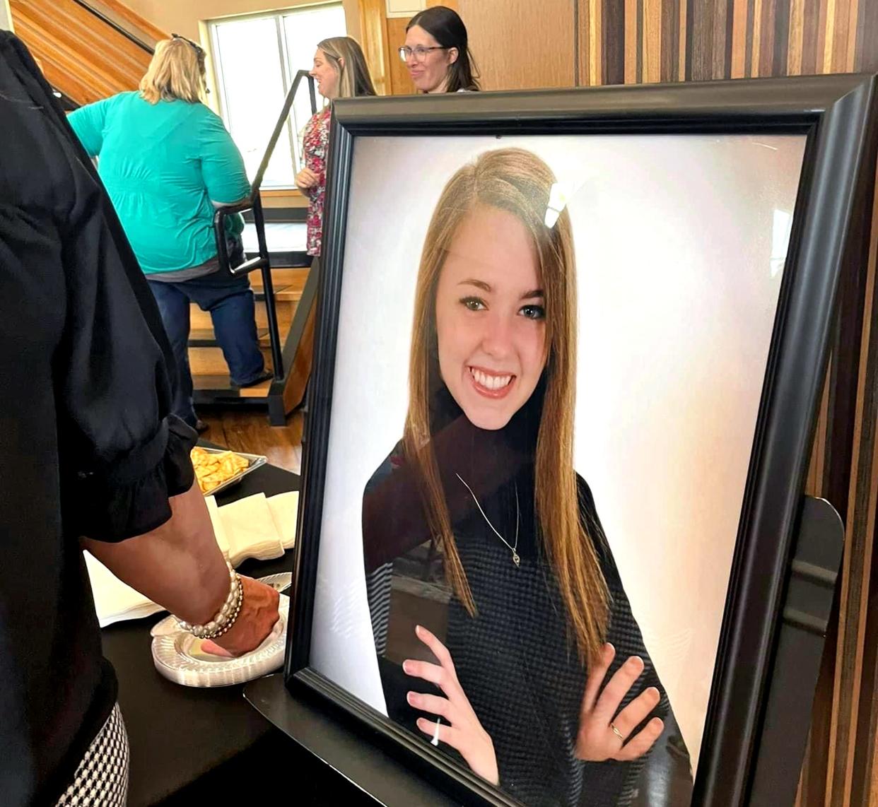 A portrait of Erin Swezey is displayed during a reception after the dedication of the new Missions Trail at Falls Creek Baptist Camp & Conference Center near Davis.