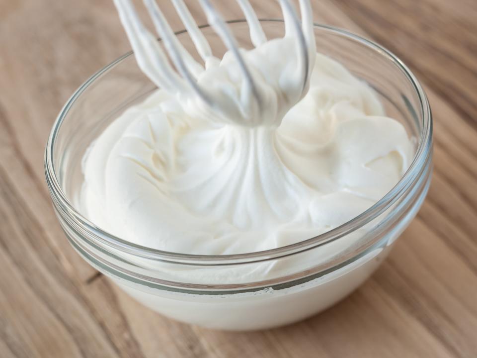 <h1 class="title">Whipped cream and whisk in glass bowl</h1><cite class="credit">billnoll</cite>