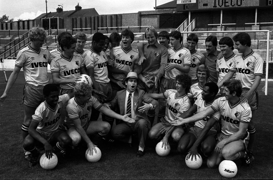 1982: Chairman Elton John leads his first team squad in a song at Vicarage Road as Watford get ready for their first 1st Division clash against Everton on Saturday at home. The club announced a  400,000 sponsorship deal with truck and bus giants Iveco.