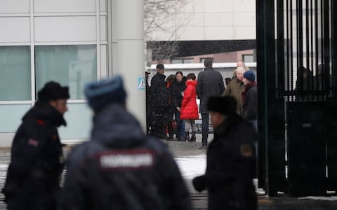  Members of the British embassy staff gather at its compound in Moscow - Credit: TATYANA MAKEYEVA /Reuters