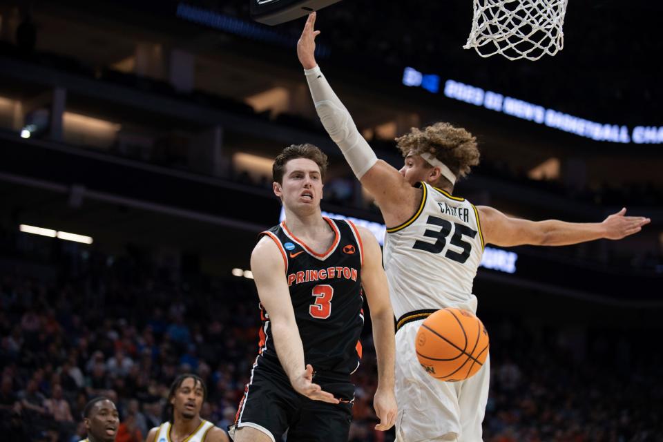 Missouri forward Noah Carter (35) looks back as Princeton guard Ryan Langborg (3) passes the ball off during the first half of a second-round game in the men's NCAA Tournament.