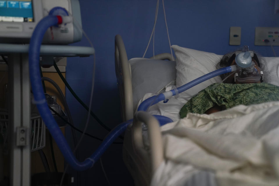 FILE - In this Jan. 7, 2021, file photo, a COVID-19 patient is put on a ventilator at St. Joseph Hospital in Orange, Calif. The U.S. death toll from COVID-19 has almost topped 500,000 — a number so staggering that a top health researchers says it is hard to imagine an American who hasn't lost a relative or doesn't know someone who died. (AP Photo/Jae C. Hong, File)