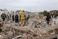 <p>Firefighters do rescue works at the site after a blast in Jiangbei District on Nov. 26, 2017 in Ningbo, Zhejiang Province of China. (Photo: VCG/VCG via Getty Images) </p>