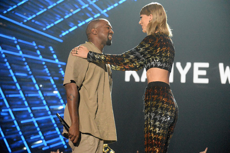 Kanye West accepts the Michael Jackson Video Vanguard Award from Taylor Swift during the 2015 MTV Video Music Awards on Aug. 30, 2015, in L.A. (Photo: Jeff Kravitz/MTV1415/FilmMagic) 