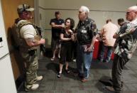 A police officer prevents attendees from leaving the Muhammad Art Exhibit and Contest after it was reported that shots were fired outside the venue and a man is down in Garland, Texas May 3, 2015. REUTERS/Mike Stone