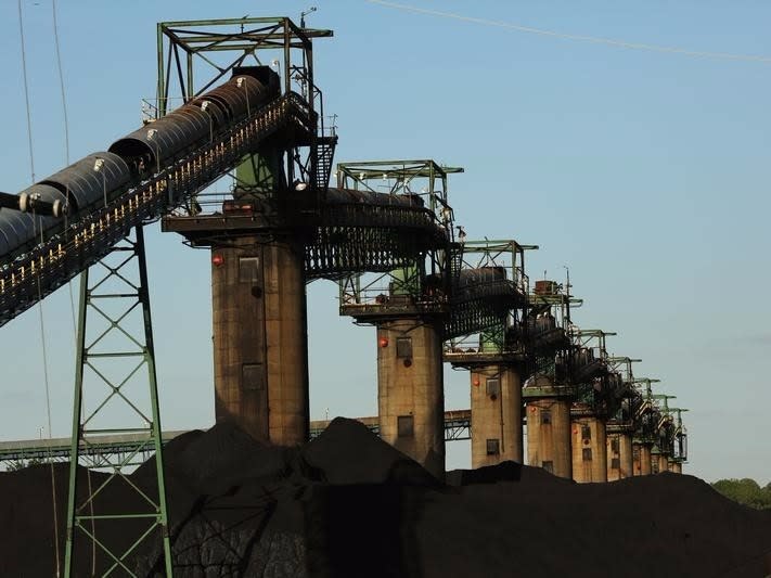 Coal is stacked at the base of coal loaders along the Ohio River in Ceredo, West Virginia May 18, 2014. REUTERS/Robert Galbraith