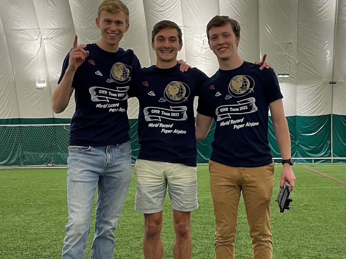 Nathan Erickson (from left), Dillon Ruble and Garrett Jensen made history on Decemeber 2, 2022, in Crown Point, Indiana, for the farthest flight by a paper aircraft.
