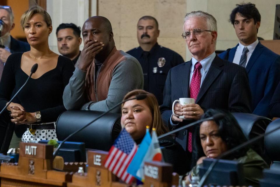 City Council members and staff listen to Melina Abdullah speak about LAPD killings of Takar Smith and Keenan Anderson.