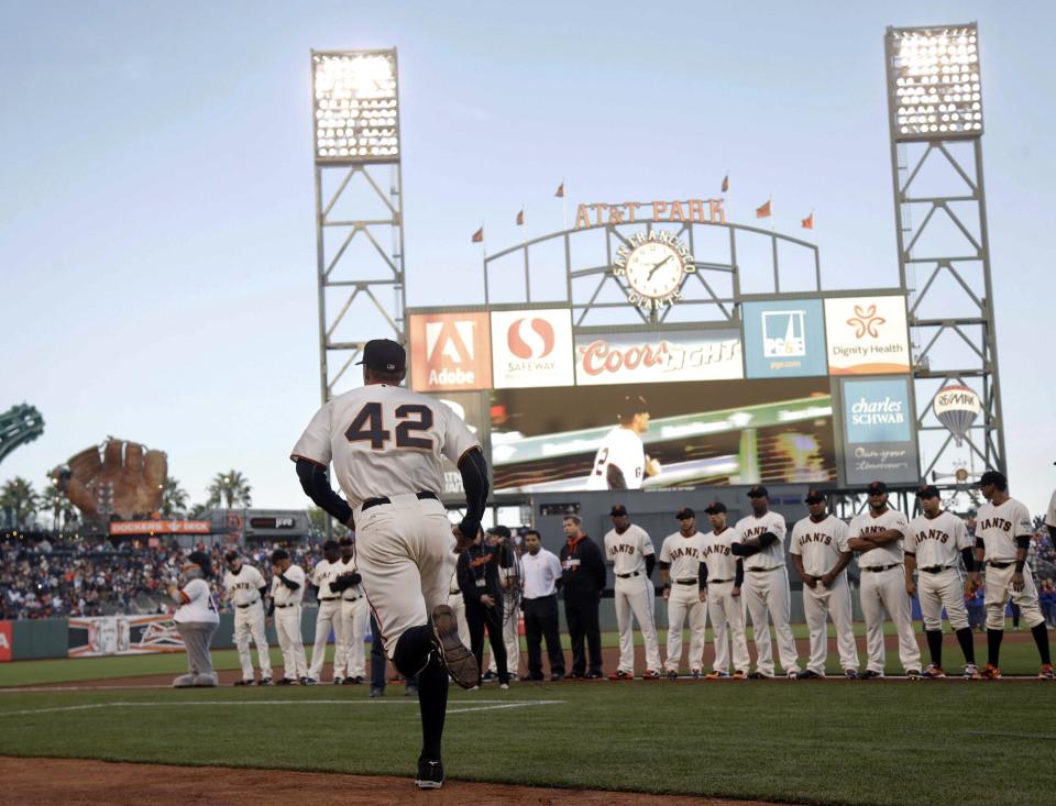 San Francisco Giants right fielder Hunter Pence wears Jackie Robinson's No. 42 as he is introduced before the Giants' baseball game against the Los Angeles Dodgers on Tuesday, April 15, 2014, in San Francisco. (AP Photo/Marcio Jose Sanchez)