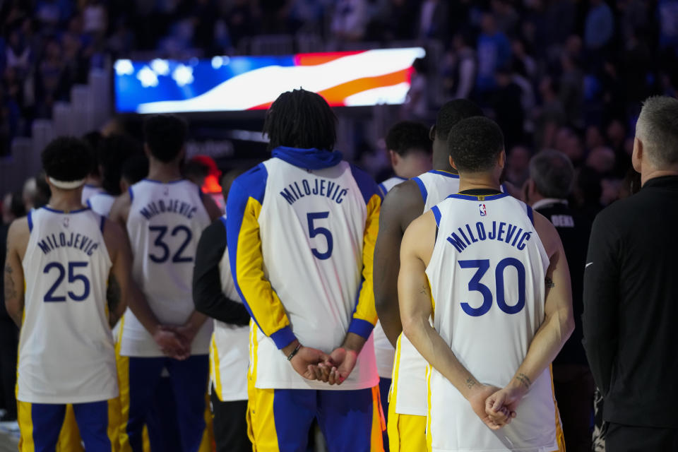 The Golden State Warriors listen to the national anthem before an NBA basketball game against the Atlanta Hawks, Wednesday, Jan. 24, 2024, in San Francisco. (AP Photo/Godofredo A. Vásquez)