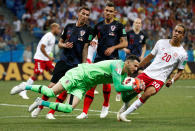 <p>Danijel Subasic makes a save from Denmark’s Yussuf Poulsen </p>