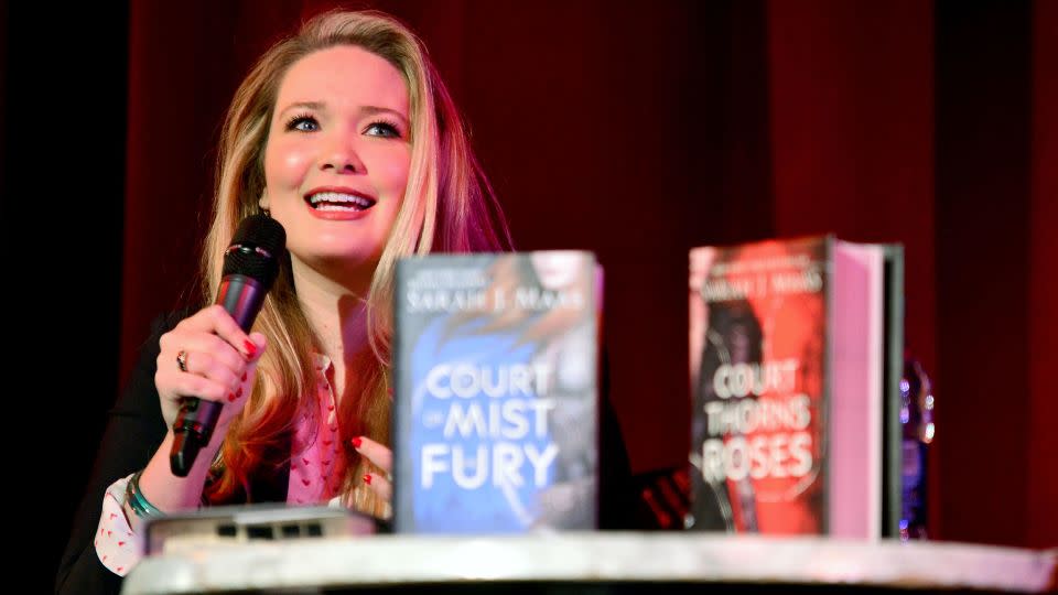 Sarah J. Maas speaks to fans at an event in 2016. After her books took off on TikTok last year, bookstores across the country hosted midnight release parties for her newest book, "House of Flame and Shadow." - WENN/Alamy