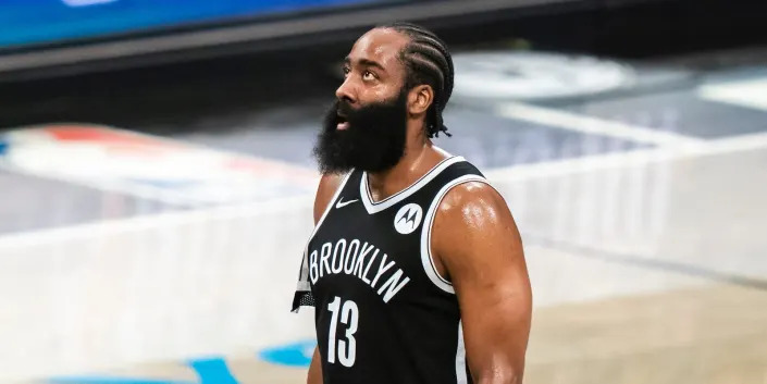 James Harden looks up during game in 2021.