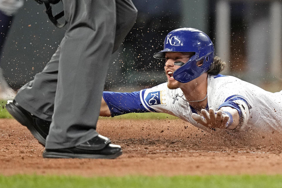 Kansas City Royals' Bobby Witt Jr. slides home to score after hitting an inside-the-park home run during the fifth inning of a baseball game against the Seattle Mariners Monday, Aug. 14, 2023, in Kansas City, Mo. (AP Photo/Charlie Riedel)