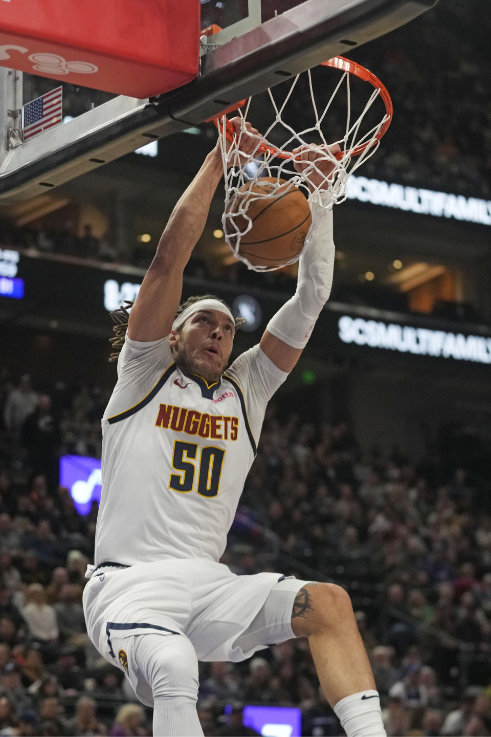 Denver Nuggets forward Aaron Gordon (50) dunks against the Utah Jazz during the first half of an NBA basketball game Wednesday, Jan. 10, 2024, in Salt Lake City. (AP Photo/Rick Bowmer)