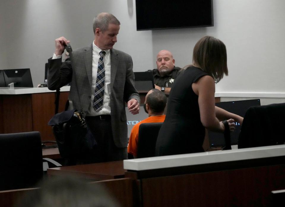 Darrell Brooks Jr’s., attorneys Anna Kees, right, and Jeremy Perri, left, prepare to leave court after Brooks, right, is granted to proceed in the trial without council on Wednesday. The trial is set to begin next Monday.