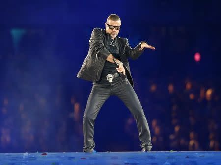 George Michael performs at the closing ceremony of the London 2012 Olympic Games at the Olympic stadium August 12, 2012. REUTERS/Kai Pfaffenbach/File Photo