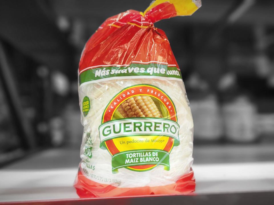 A package of Guerrero tortillas with green and red labels and a picture of corn on the front of the bag