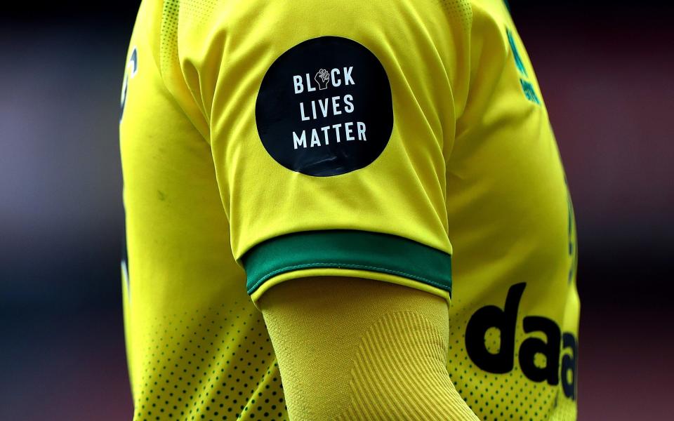 A Norwich City player wears a Black Lives Matter badge during the Premier League match between against Arsenal - Getty Images