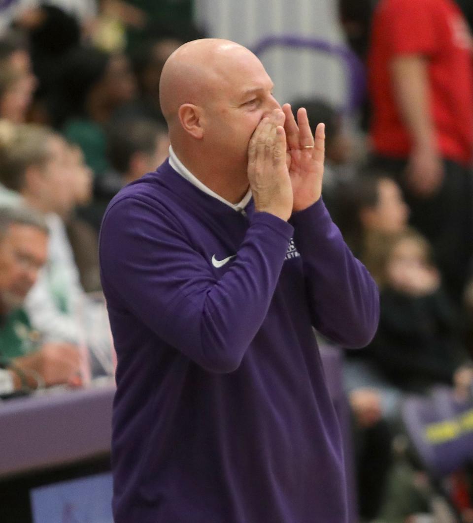 Jackson boys basketball head coach Tim Debevec shouts instructions during game against GlenOak, Friday, Dec. 22, 2023.