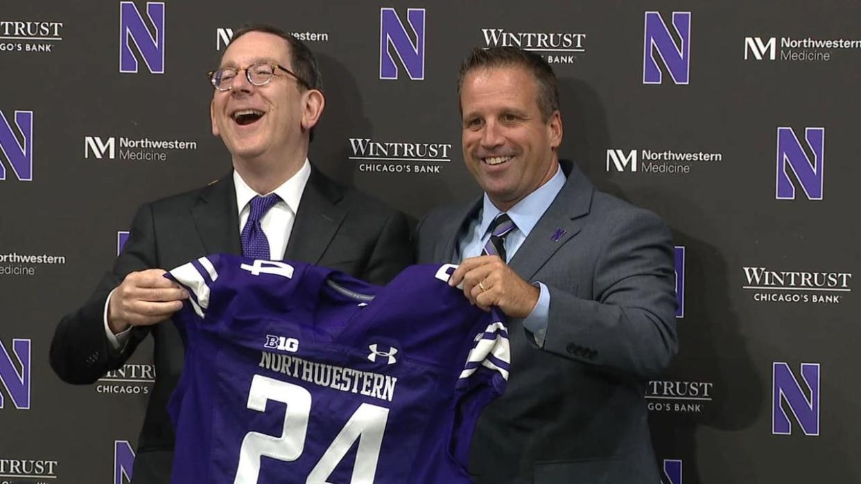 <div>Northwestern president Michael Schill laughs with new athletic director Mark Jackson during Jackson's introduction on Sept. 3, 2024, in Evanston, Ill.</div>