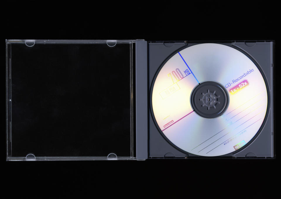 An open CD case with a blank CD inside