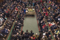 Britain's Prime Minister Theresa May, centre left, speaks in the House of Commons, after MPs rejected a no-confidence vote against the government, in London, Wednesday Jan. 16, 2019. Prime Minister Theresa May won the no confidence vote called for by opposition Labour Party leader Jeremy Corbyn, following the dramatic failure of the government Brexit vote. (Mark Duffy, UK Parliament via AP)