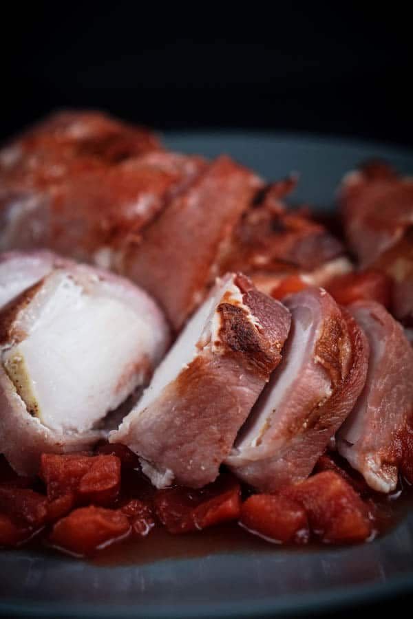 <p>Talk about a meaty Thanksgiving dish, this turkey from <a href="https://ketogasm.com/bacon-wrapped-turkey-breast-tomatoes-recipe/" rel="nofollow noopener" target="_blank" data-ylk="slk:Ketogasm;elm:context_link;itc:0;sec:content-canvas" class="link ">Ketogasm </a>is wrapped in bacon for a feast for any carnivore out there. The one pot dish contains just three grams of net carbs, along with great protein and fat to fill you up. It’ll cook for about six hours, but you don’t need to do much—just put it in and wait.</p>