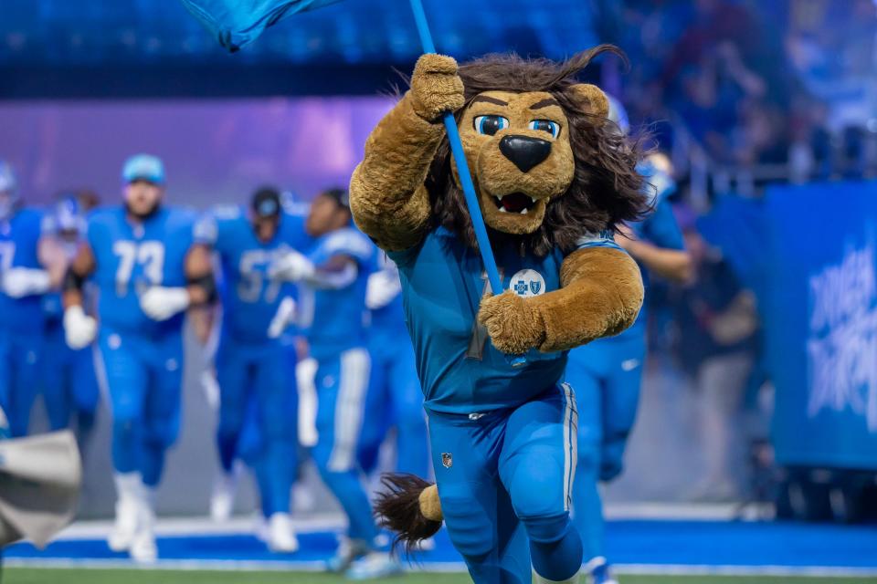 Week 14: Roary, the Detroit Lions mascot, runs onto the field before the start of the game against the Minnesota Vikings at Ford Field.