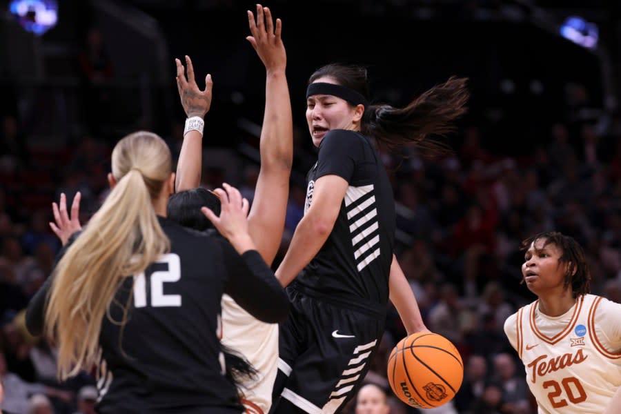 Gonzaga guard Kayleigh Truong passes the ball during the first half of a Sweet 16 college basketball game against Texas in the women’s NCAA Tournament, Friday, March 29, 2024, in Portland, Ore. (AP Photo/Howard Lao)