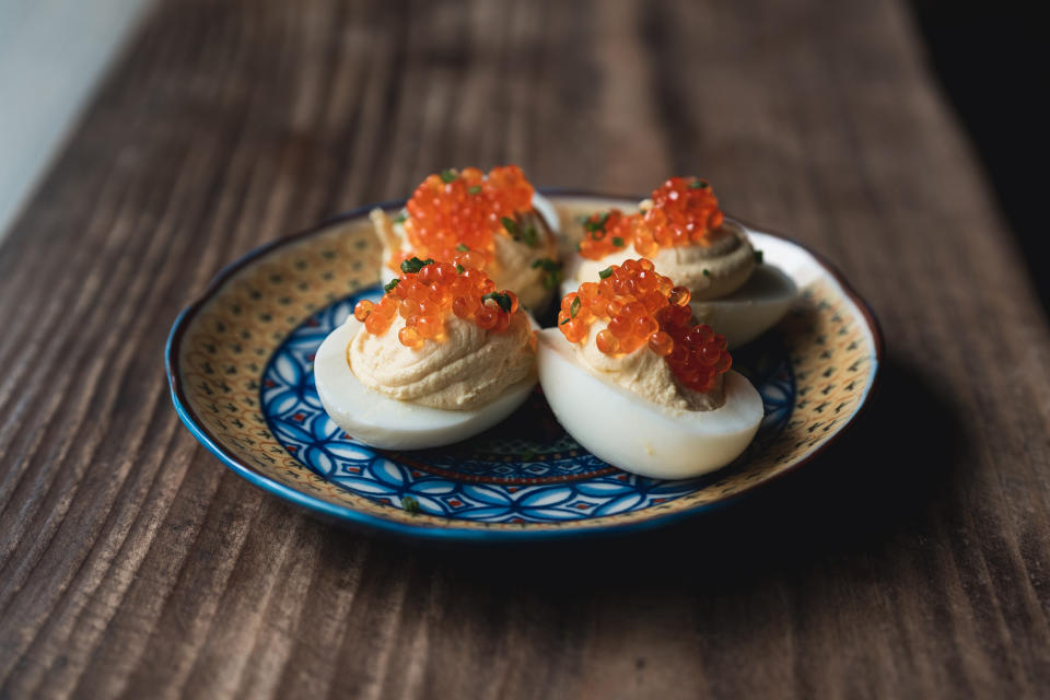 Fête's deviled eggs topped with smoked trout roe and chives. (Sean Marrs)