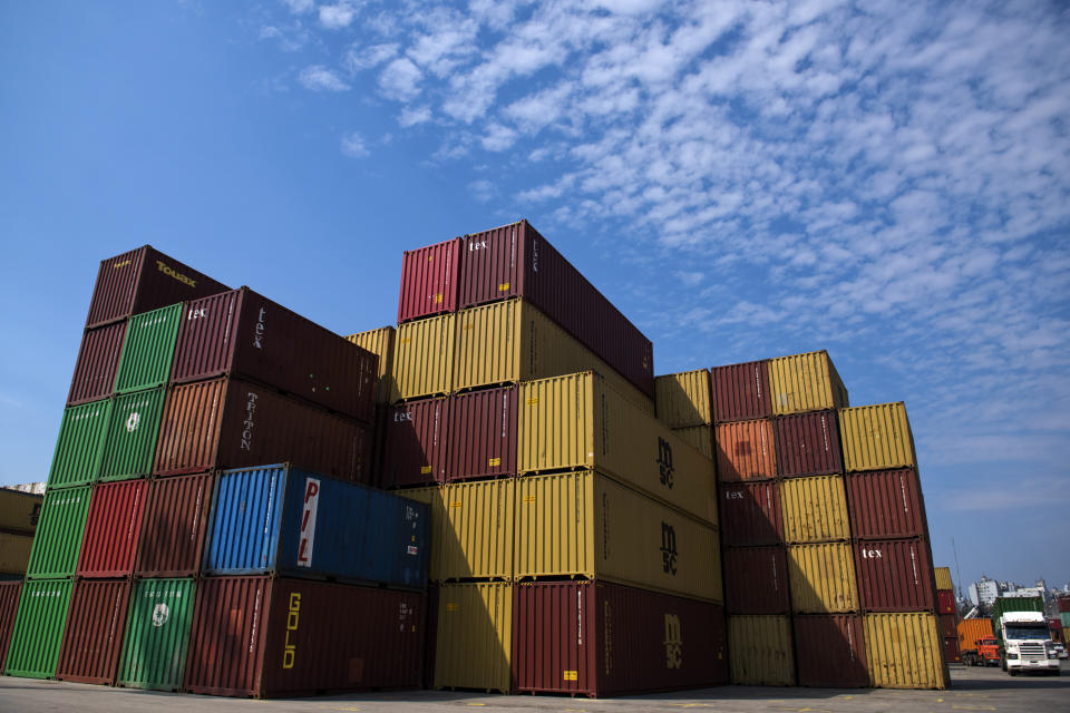In this Sept. 19, 2019 photo, stacked containers stand in the Port of Montevideo, Uruguay. In the port of Montevideo, the customs terminal has a single scanner that is operated by officials who only work during office hours, never at night. Additionally, the machine is only used to check imports. (AP Photo/Matilde Campodonico)