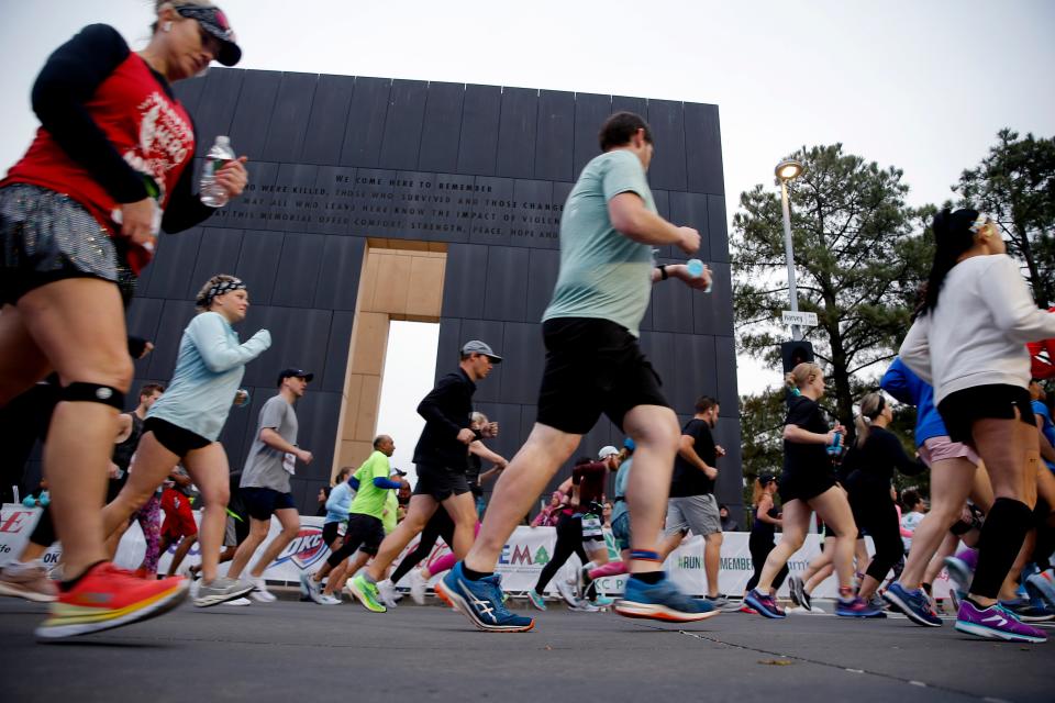 Runners run by the 9:03 gate during the 2022 Oklahoma City Memorial Marathon on April 24, 2022.