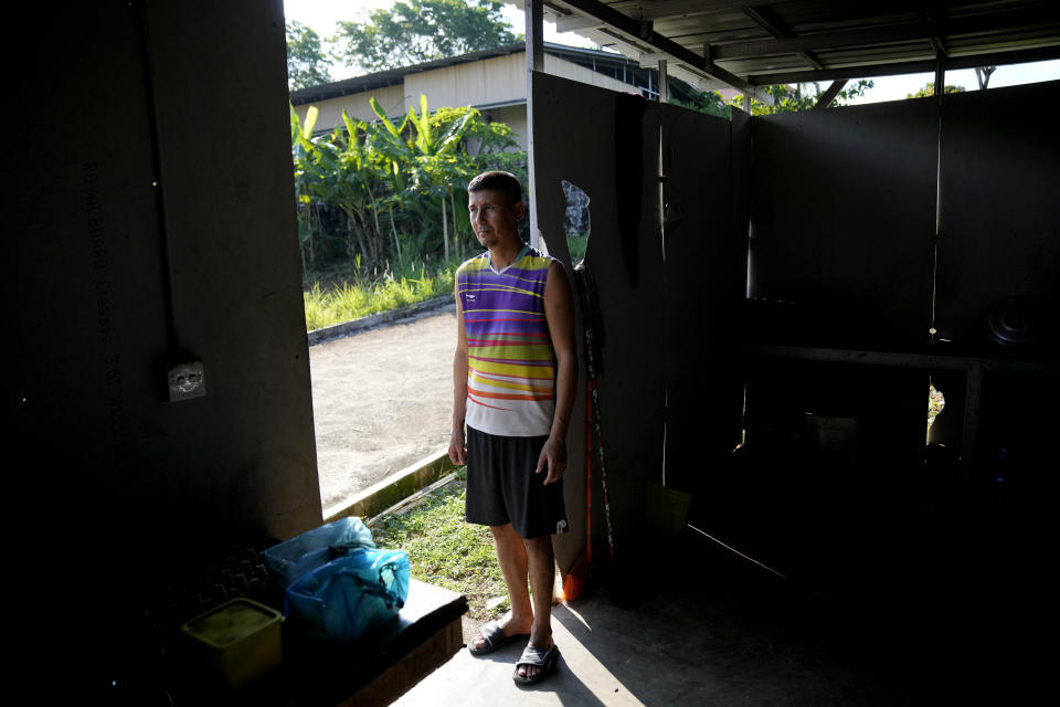 Mohammad Khan Husaini, a 30-year-old Afghan who has been in Indonesia for 11 years, stands at a resort turned into a shelter in Tanjungpinang, Bintan Island, Indonesia, Tuesday, May 14, 2024. Many refugees had fled to the sprawling Southeast Asian archipelago as a jumping-off point hoping to eventually reach Australia by boat, but are now stuck in what feels like an endless limbo. (AP Photo/Dita Alangkara)