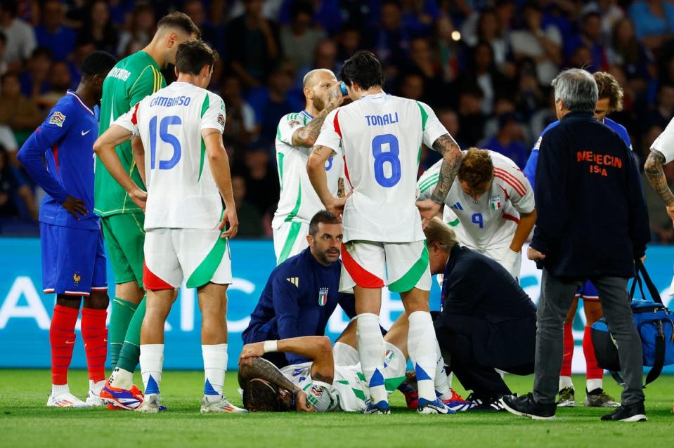 Injury blow: Arsenal defender Riccardo Calafiori receives treatment during Italy’s win over France (REUTERS)