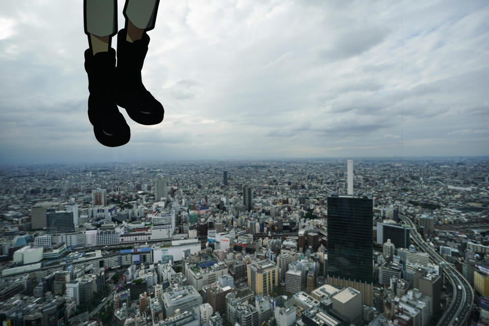 A cutout of a Japanese manga character is displayed on the large window of the Sky Circus Sunshine 60 observatory Monday, Oct. 7, 2019, in Tokyo. (AP Photo/Jae C. Hong)