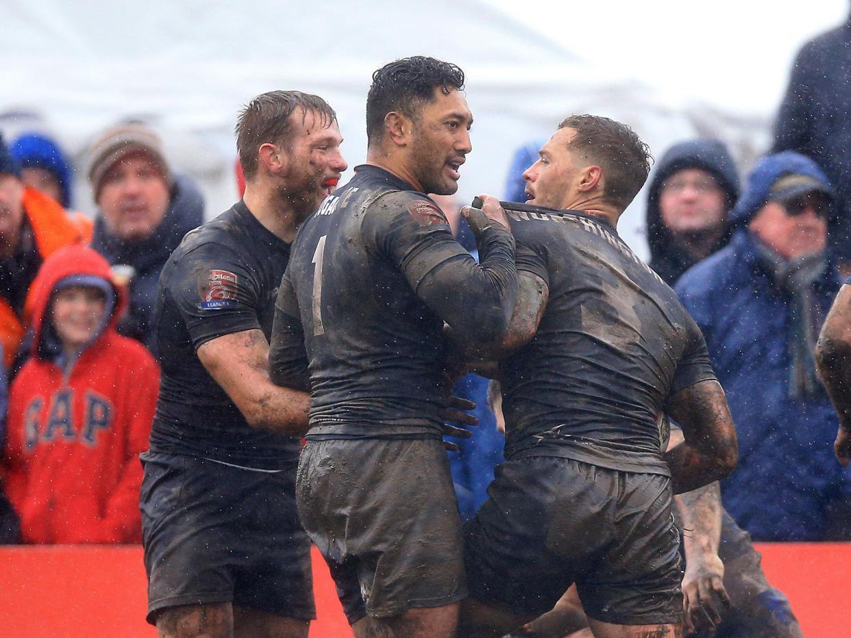 Toronto Wolfpack's Craig Worthington celebrates with team-mate Quentin Laulu Tugagae after scoring a try: PA