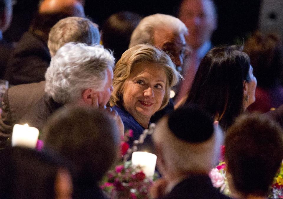 Former Secretary of State Hillary Rodham Clinton talks with other guests before receiving the American Jewish Congress' lifetime achievement award on Wednesday March 19, 2014, in New York. (AP Photo/Jin Lee)