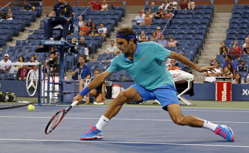 Roger Federer caught fire when play resumed after a rain delay, even though there weren't many yet in the stadium to witness it. (AP Photo/Elise Amendola)