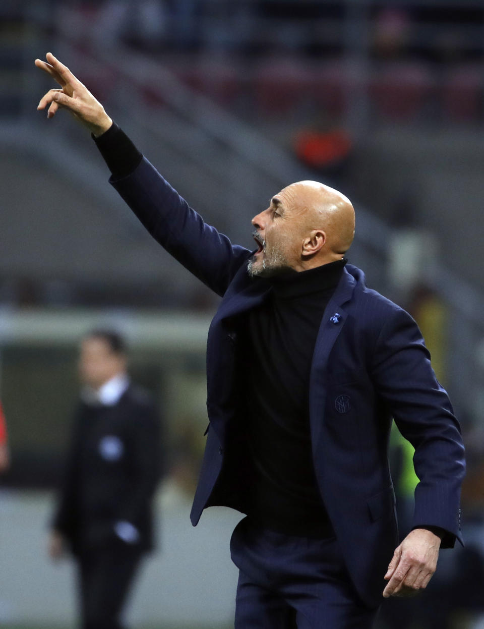 Inter Milan coach Luciano Spalletti gives instructions to his players during the Europa League round of 16 second leg soccer match between Inter Milan and Eintracht Frankfurt at the San Siro stadium in Milan, Italy, Thursday, March 14, 2019. (AP Photo/Antonio Calanni)