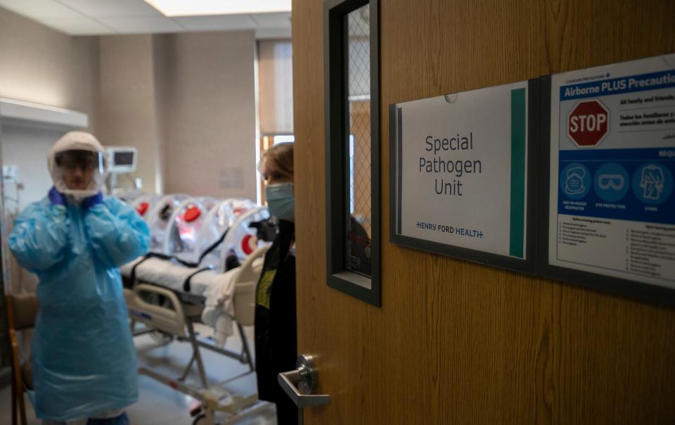 Registered Nurse and Infectious Disease Educator Tyler Marrs, 29, of Detroit, stands in the special pathogen unit inside the Henry Ford Hospital in Detroit on Tuesday, Nov. 1, 2022. 