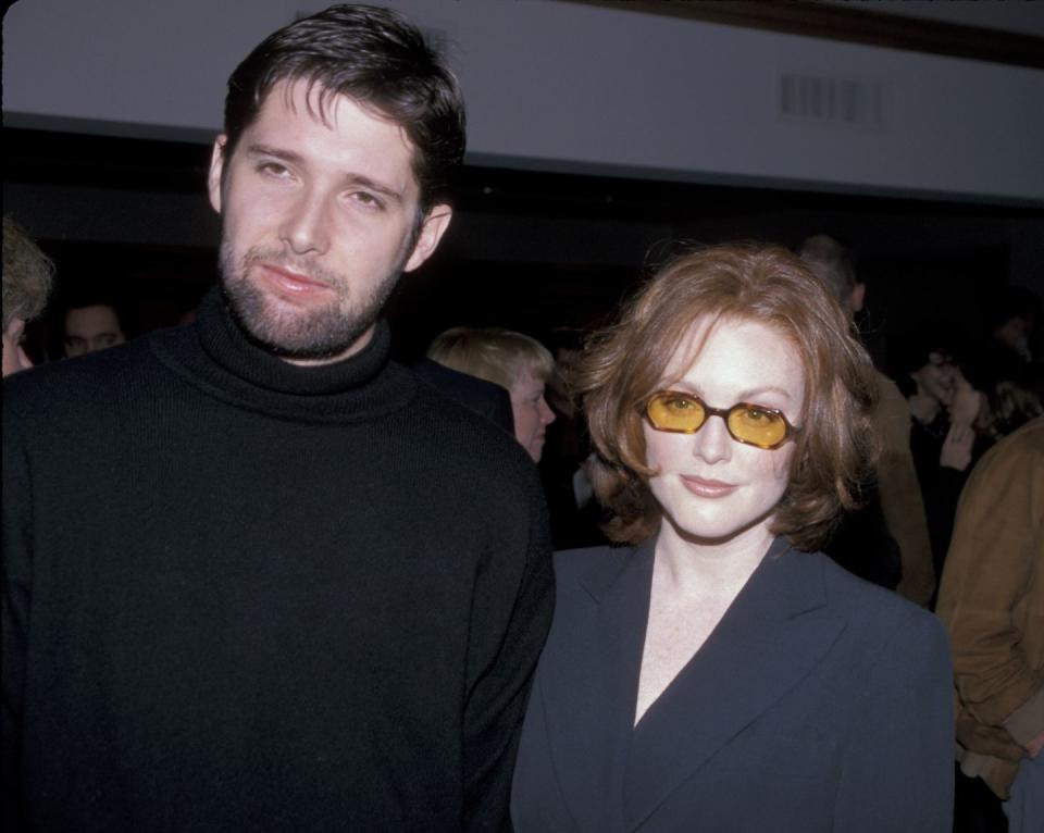 <p>Film director Bart Freundlich and Moore started dating in 1997 after crossing paths on the set of <em>The Myth of Fingerprints</em>. The two later married in 2003 and have two children together, Caleb and Liv Helen. Here, the two pose for a photo at the LAFCA Awards Luncheon. </p>