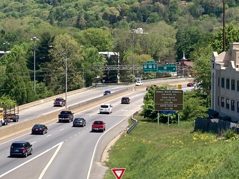 The view of the new Merrimon Avenue exit sign from Flint Street bridge on April 24, 2023.