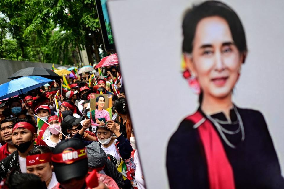 Protesters in Bangkok hold photos of Aung San Suu Kyi, Myanmar’s detained former leader, on July 26, 2022. <a href="https://media.gettyimages.com/photos/protesters-shout-slogans-and-hold-photos-of-detained-myanmar-civilian-picture-id1242117862?s=2048x2048" rel="nofollow noopener" target="_blank" data-ylk="slk:Manan Vatsyayana/AFP via Getty Images;elm:context_link;itc:0;sec:content-canvas" class="link ">Manan Vatsyayana/AFP via Getty Images</a>