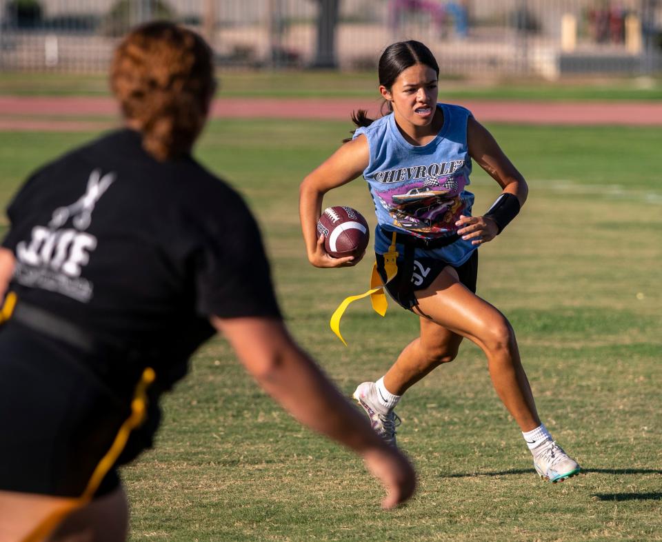 Francesca Rivera runs the ball up the field looking for a lane to avoid defenders during practice at Palm Desert High School in Palm Desert, Calif., Thursday, Sept. 14, 2023.