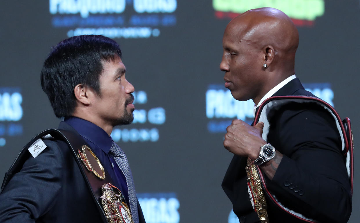 LAS VEGAS, NEVADA - AUGUST 18: Manny Pacquiao (L) and WBA welterweight champion Yordenis Ugas face off during a news conference at MGM Grand Garden Arena on August 18, 2021 in Las Vegas, Nevada. Pacquiao will challenge Ugas for his title at T-Mobile Arena on August 21 in Las Vegas. (Photo by Steve Marcus/Getty Images)
