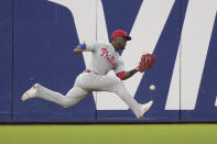 Philadelphia Phillies center fielder Odubel Herrera cannot make the catch on a triple by San Francisco Giants' LaMonte Wade Jr. during the fourth inning of a baseball game Friday, June 18, 2021, in San Francisco. (AP Photo/Tony Avelar)