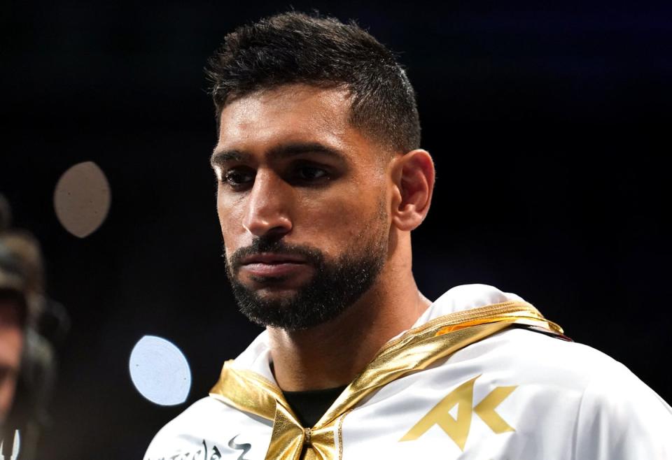 Three people have been charged after former boxing world champion Amir Khan was allegedly robbed at gunpoint (Nick Potts/PA) (PA Wire)